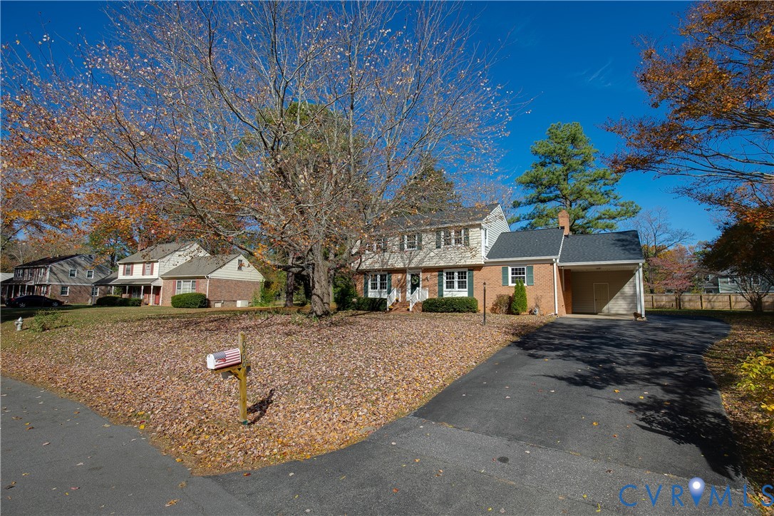 10200 Merrigan Road Richmond, VA 23235 - Photo 4 of 47 a view of a house with a yard
