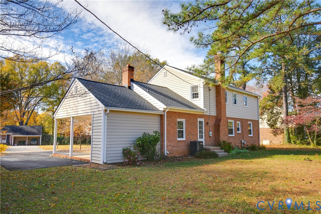 10200 Merrigan Road Richmond, VA 23235 - Photo 44 of 47 a view of a house with a yard