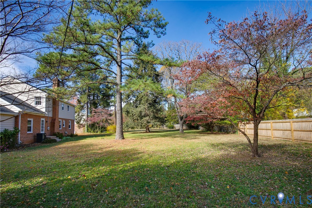 10200 Merrigan Road Richmond, VA 23235 - Photo 46 of 47 a view of a street with a building and trees in the background