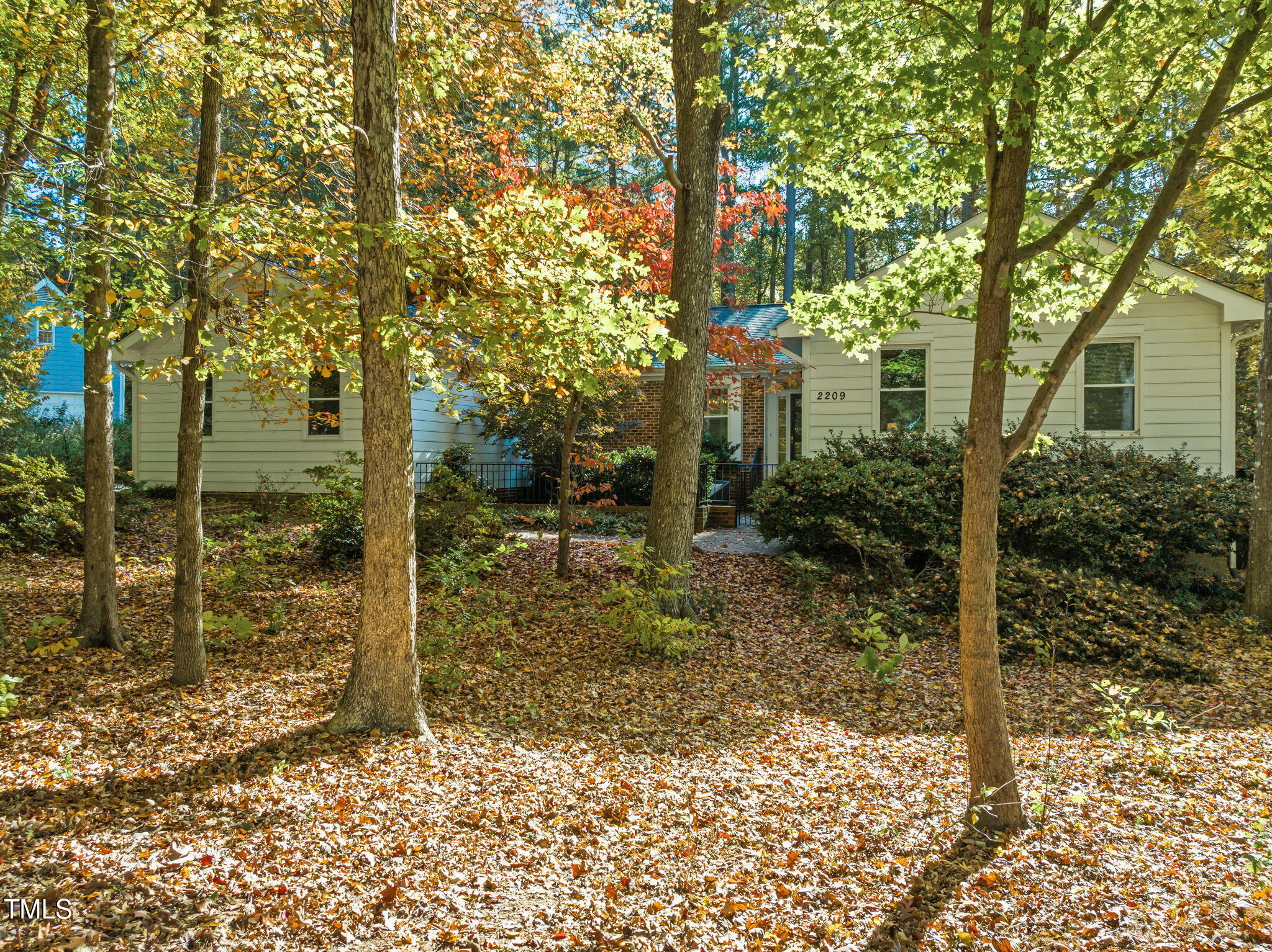 2209 Ridgefield Drive Chapel Hill, NC 27517 - Photo 1 of 57 a view of a house with a tree in the background