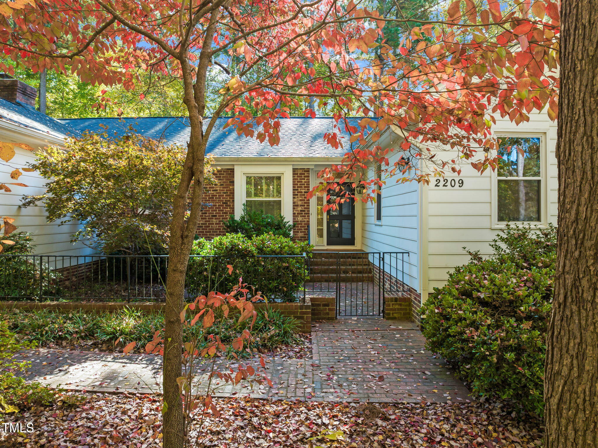 2209 Ridgefield Drive Chapel Hill, NC 27517 - Photo 2 of 57 a front view of a house with garden