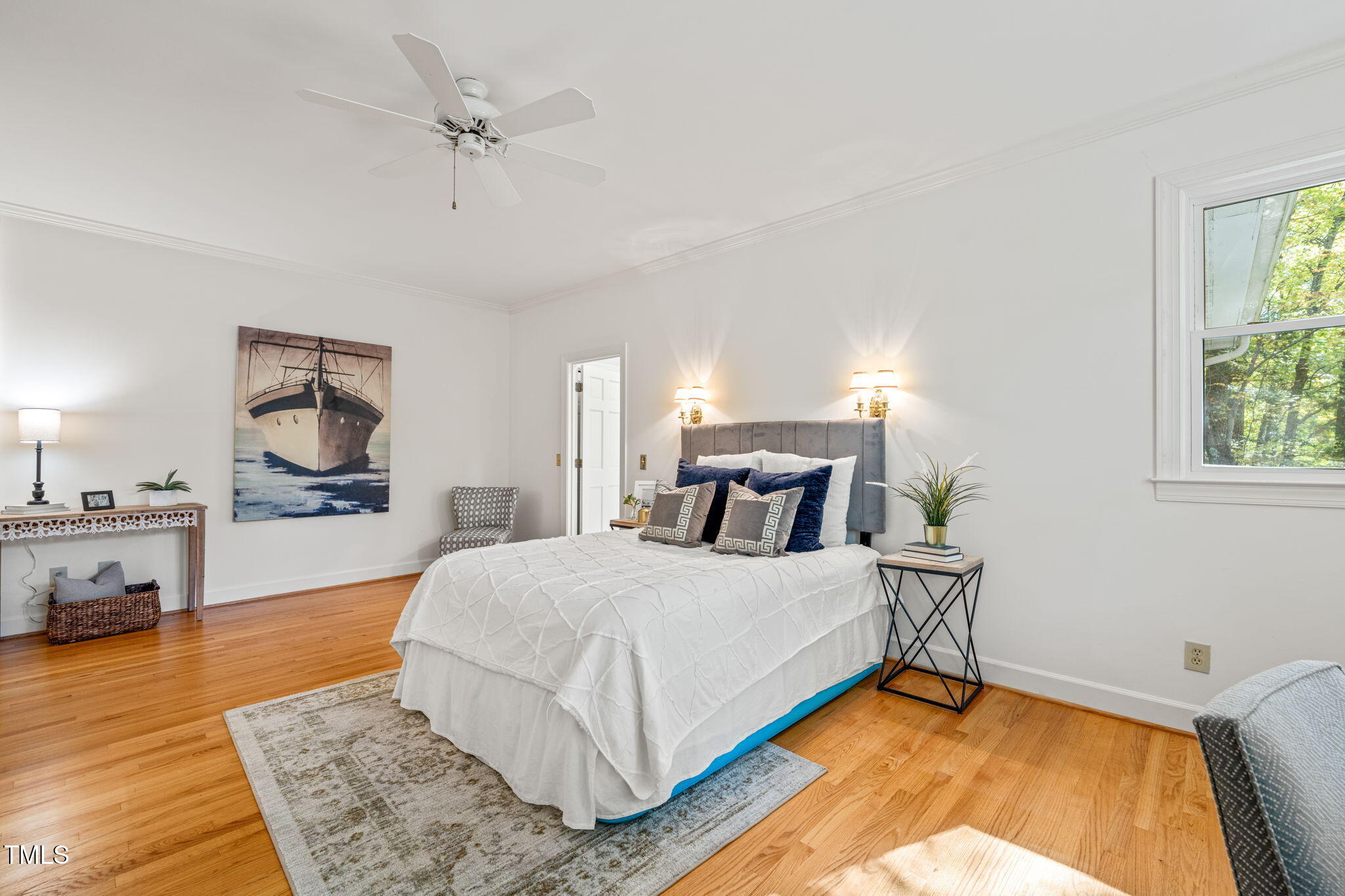 2209 Ridgefield Drive Chapel Hill, NC 27517 - Photo 21 of 57 a bedroom with a large bed a rug and windows