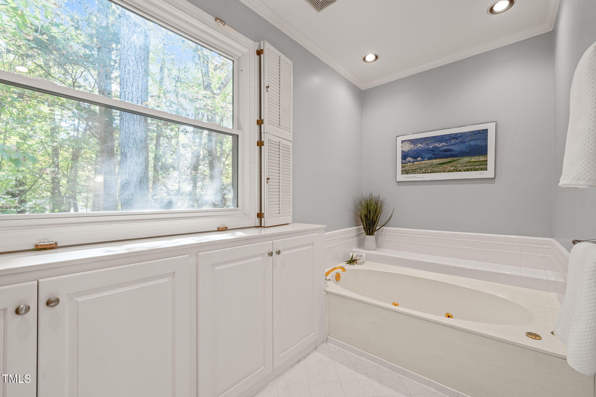 2209 Ridgefield Drive Chapel Hill, NC 27517 - Photo 27 of 57 a bathroom with a bathtub and a window