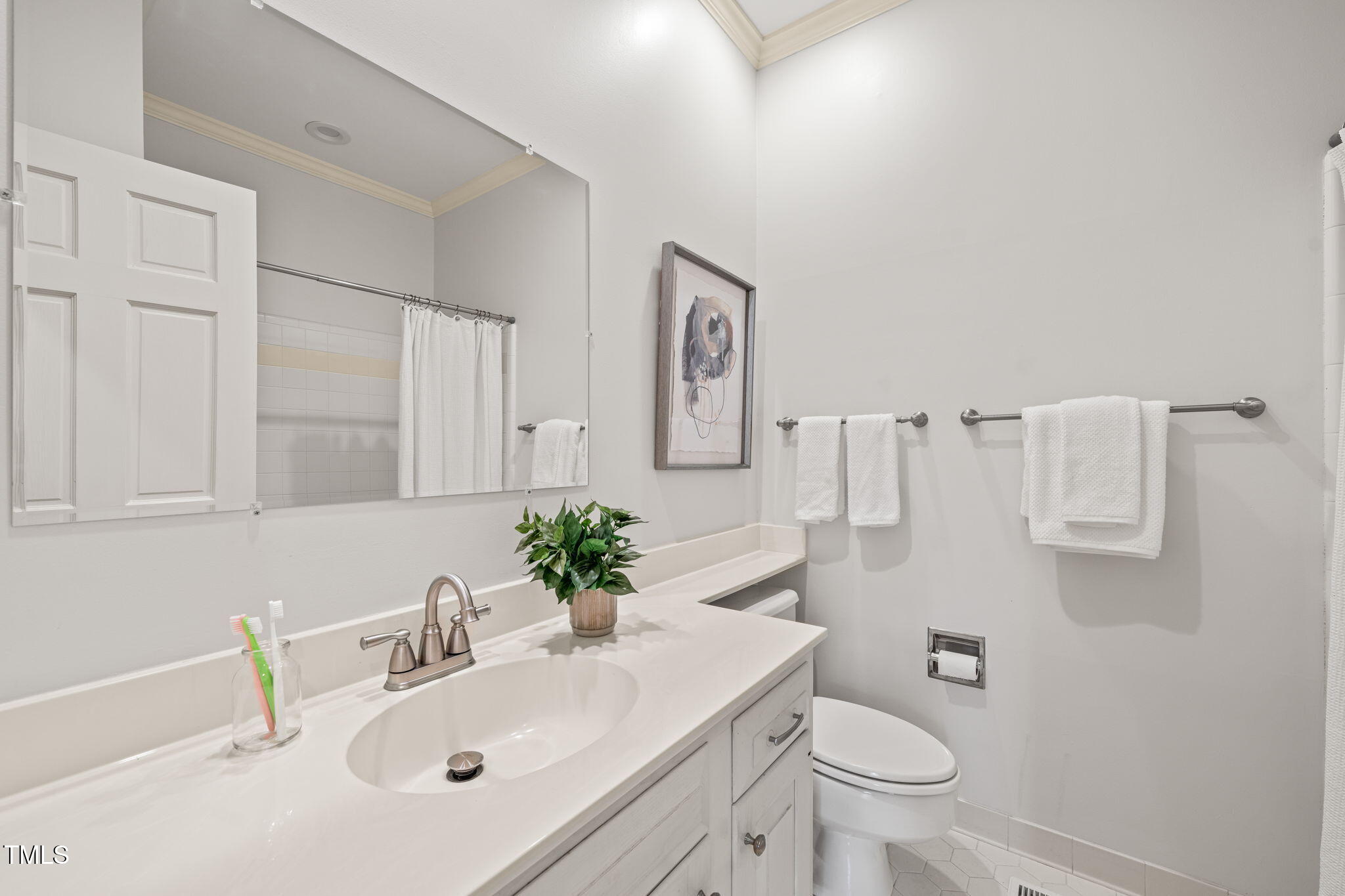 2209 Ridgefield Drive Chapel Hill, NC 27517 - Photo 32 of 57 a bathroom with a sink toilet and mirror