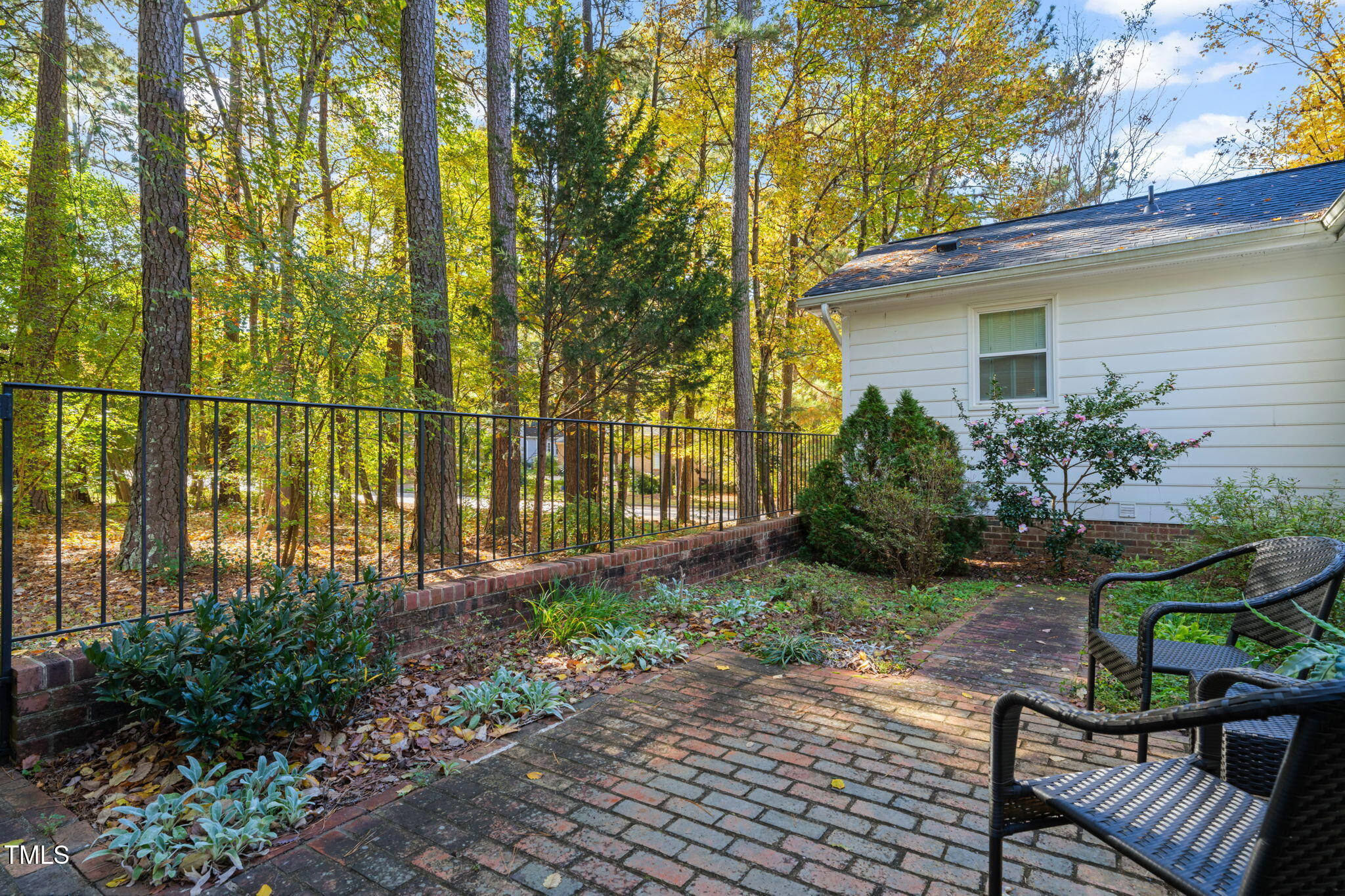 2209 Ridgefield Drive Chapel Hill, NC 27517 - Photo 40 of 57 a view of a backyard with plants and sitting area