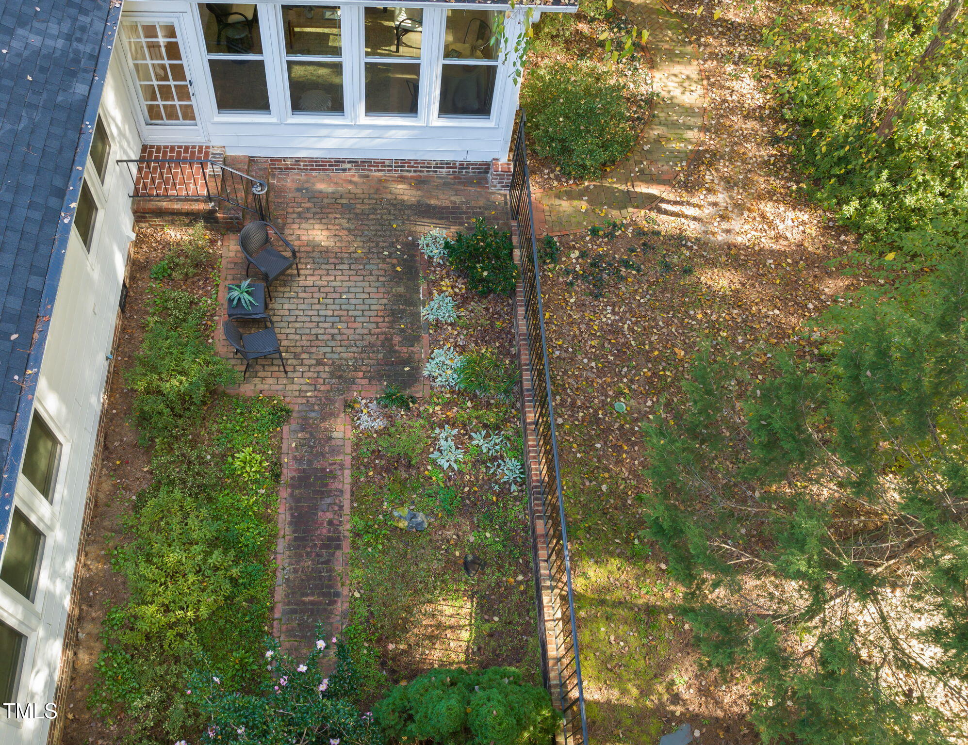2209 Ridgefield Drive Chapel Hill, NC 27517 - Photo 44 of 57 a view of a brick house with a yard