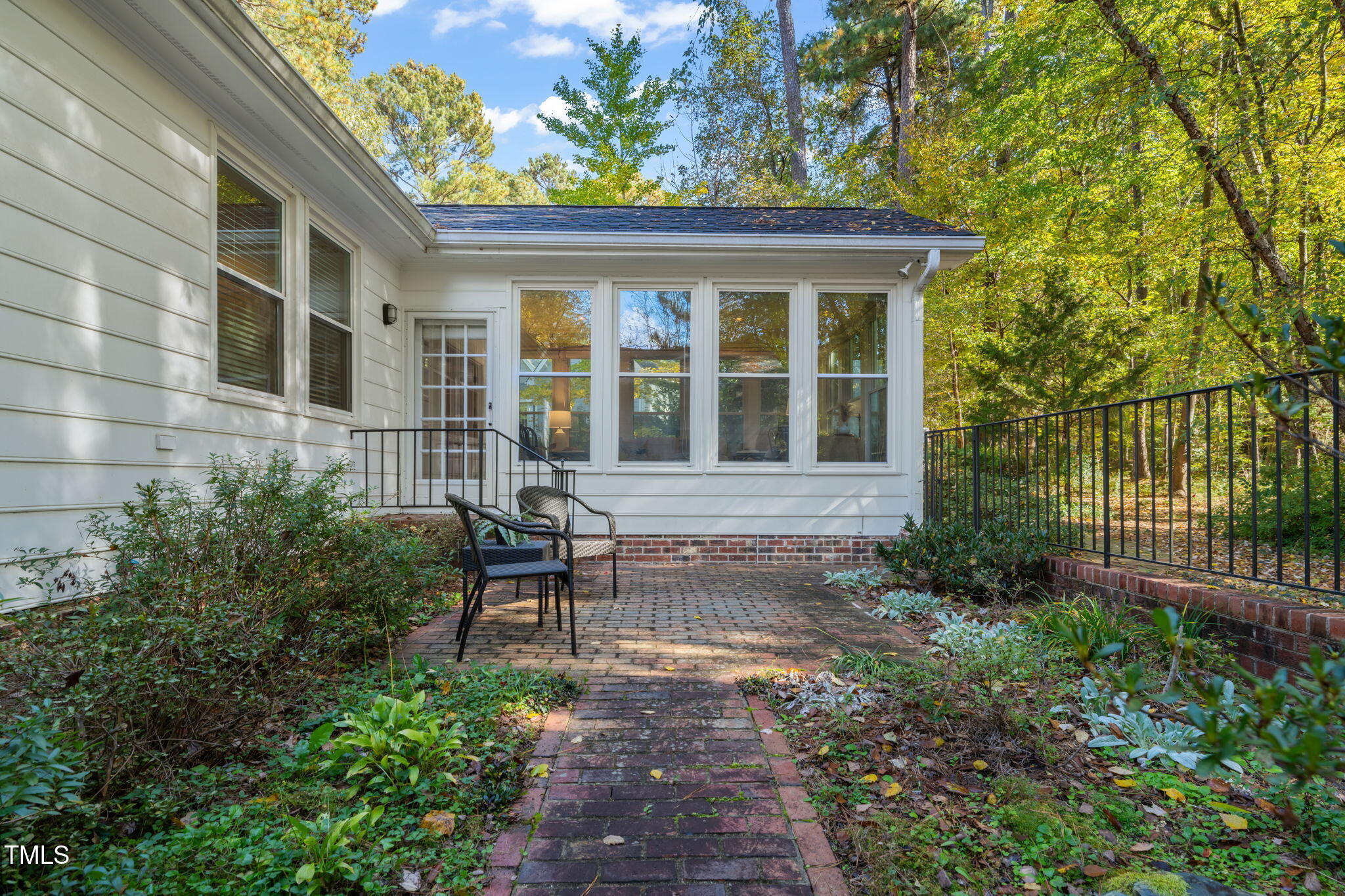 2209 Ridgefield Drive Chapel Hill, NC 27517 - Photo 47 of 57 a front view of a house with a garden