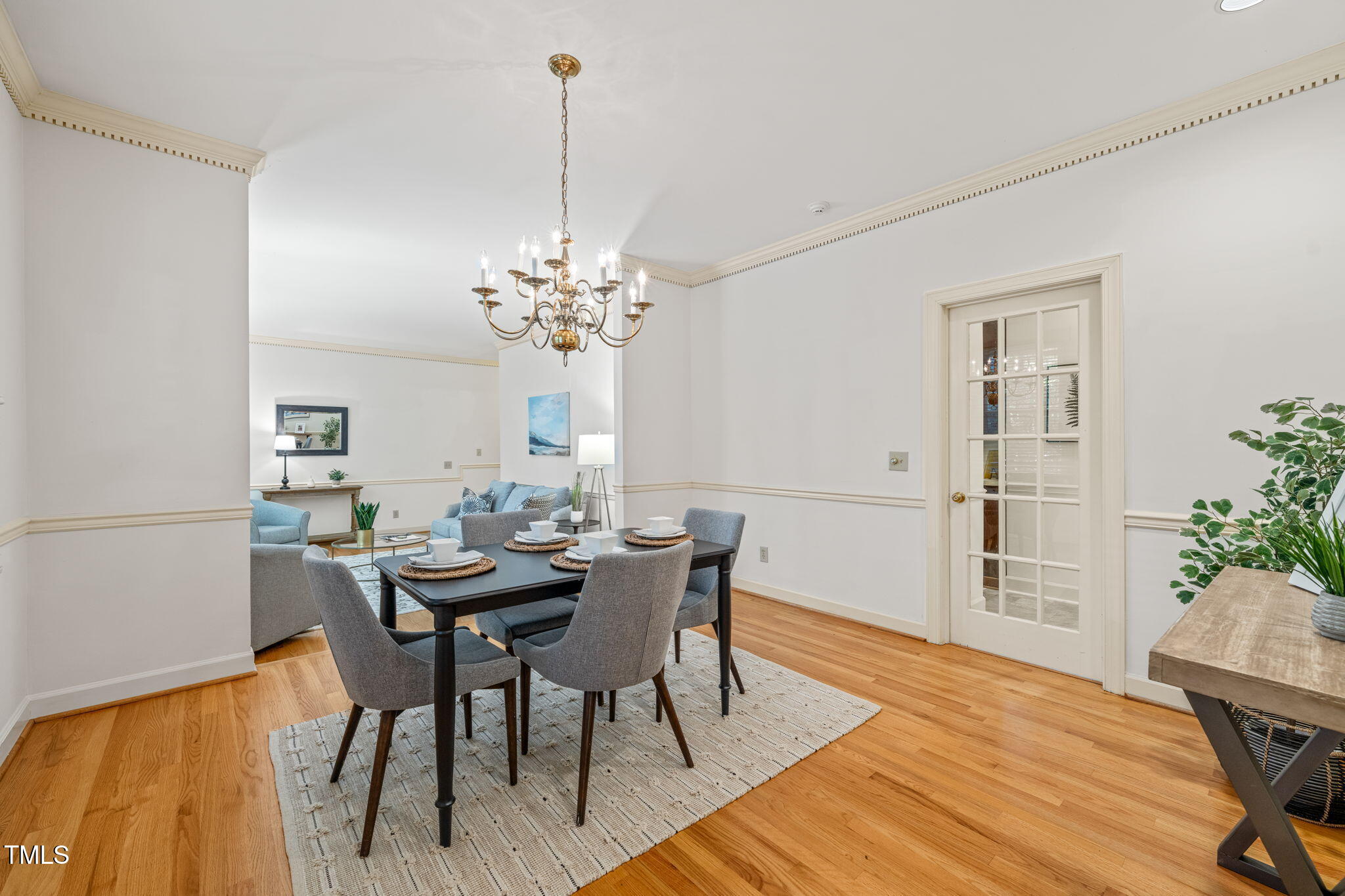 2209 Ridgefield Drive Chapel Hill, NC 27517 - Photo 9 of 57 a view of a dining room with furniture and chandelier