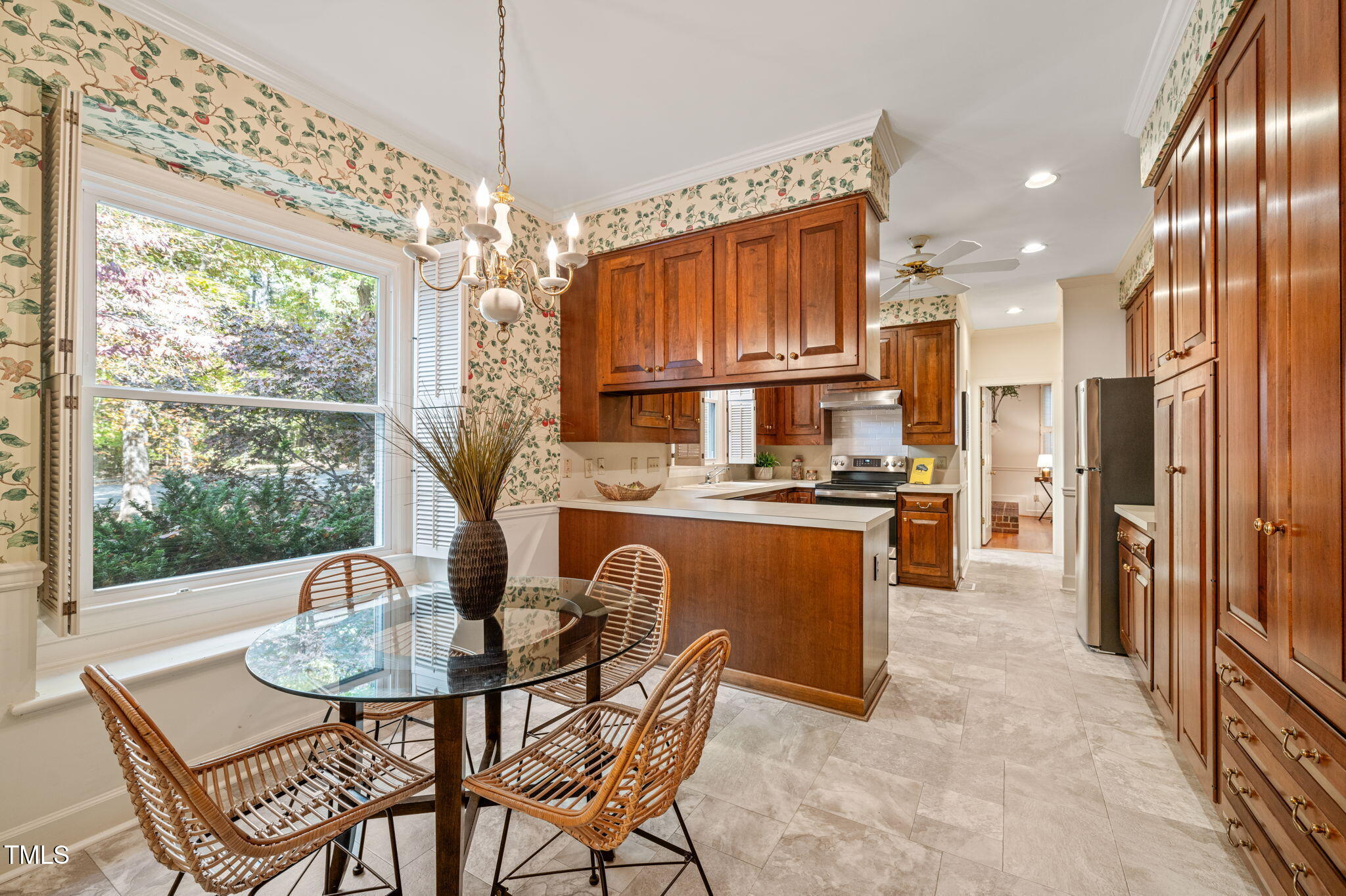 2209 Ridgefield Drive Chapel Hill, NC 27517 - Photo 10 of 57 a kitchen with granite countertop a table and chairs