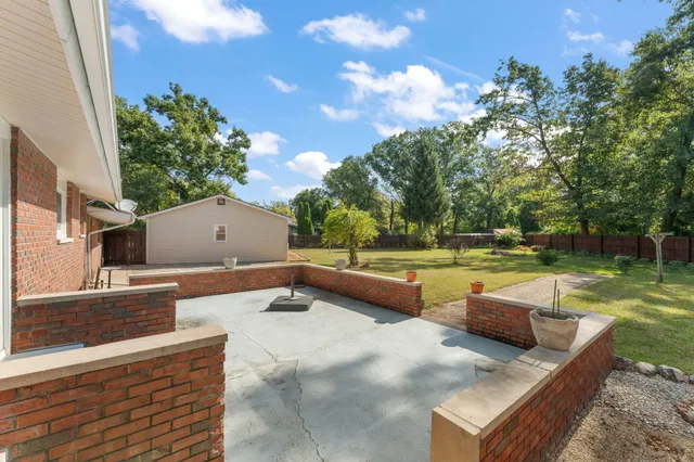 a view of a garden with a patio