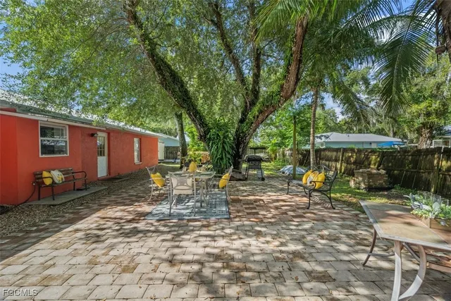 a view of a yard with tree s