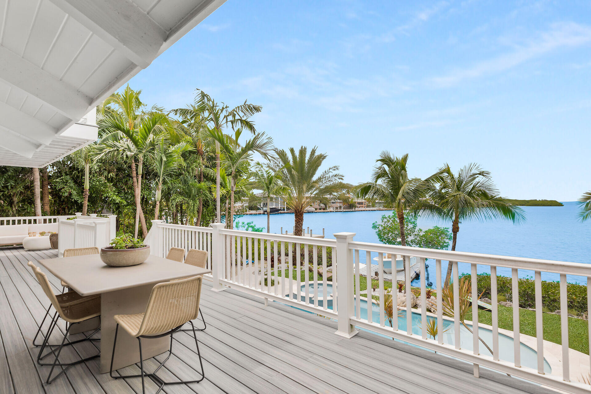 116 Gulf Side Drive Islamorada, FL 33036 - Photo 18 of 67 a view of a chairs and table on the deck