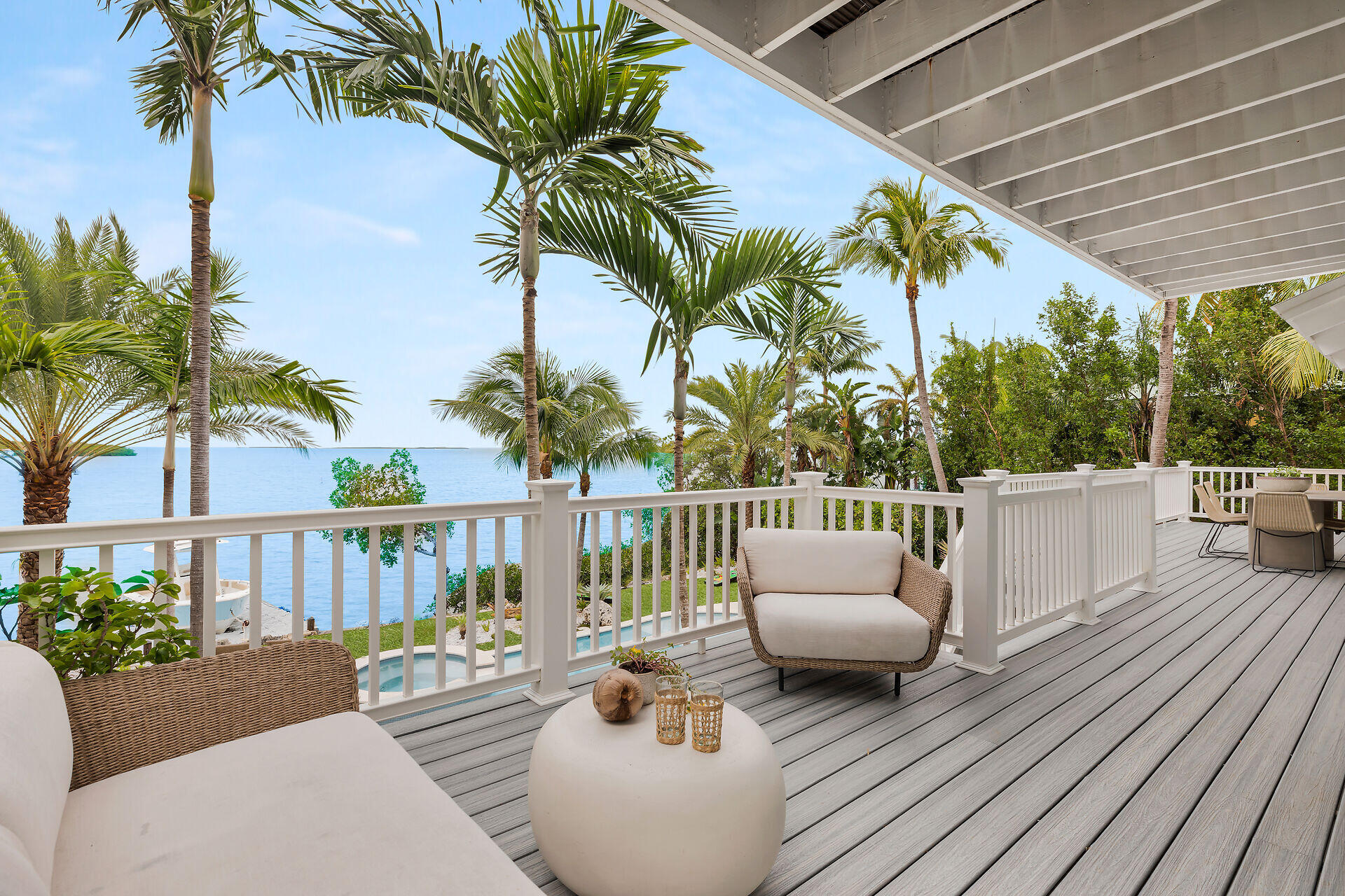 116 Gulf Side Drive Islamorada, FL 33036 - Photo 20 of 67 a balcony with furniture and a potted plant