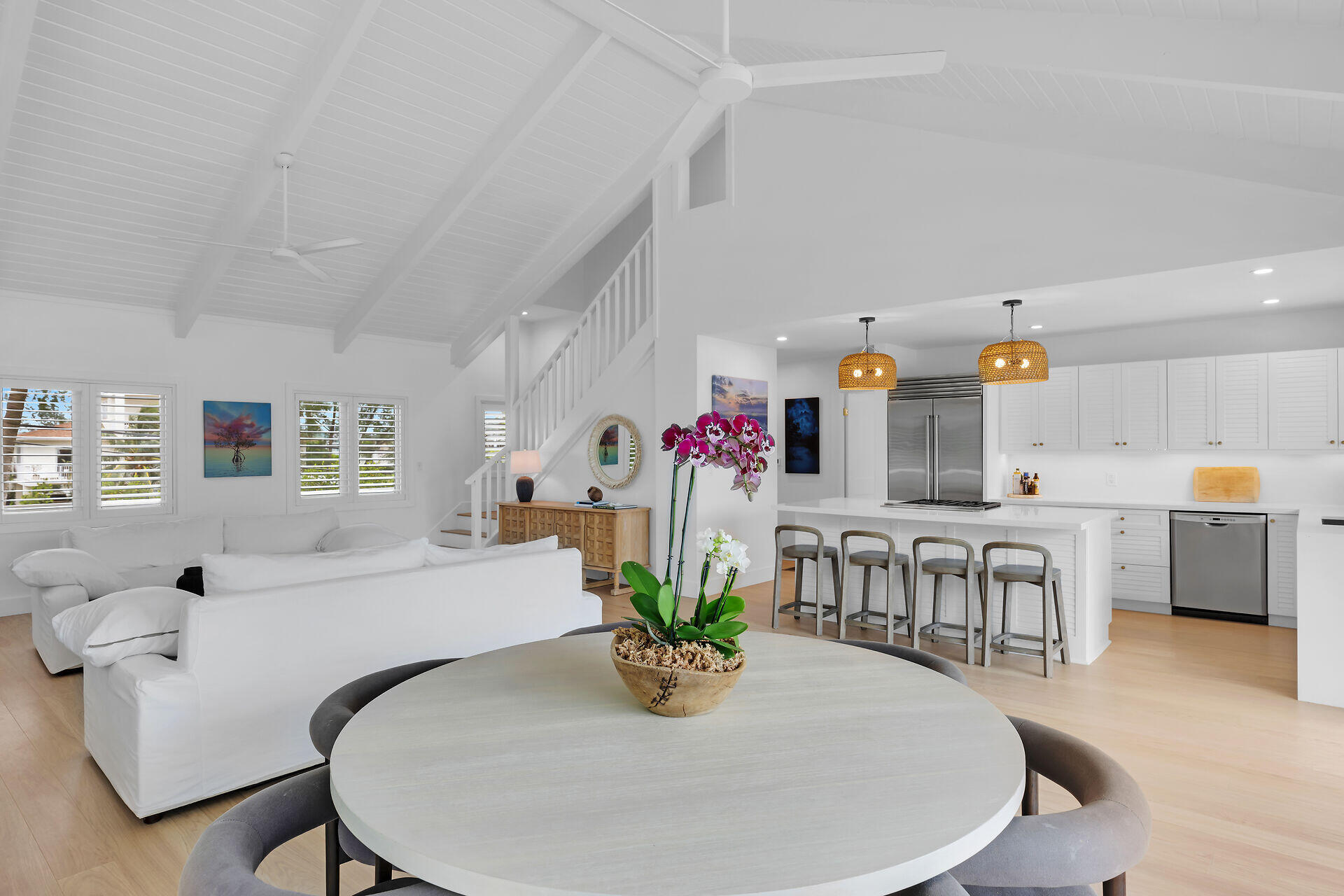 116 Gulf Side Drive Islamorada, FL 33036 - Photo 23 of 67 a dining room with furniture a potted plant and open kitchen view
