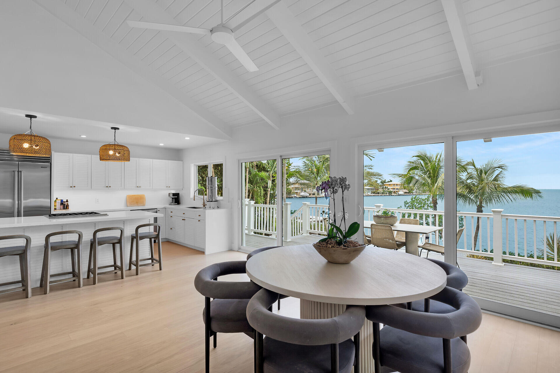 116 Gulf Side Drive Islamorada, FL 33036 - Photo 25 of 67 a view of a dining room with furniture and a potted plant