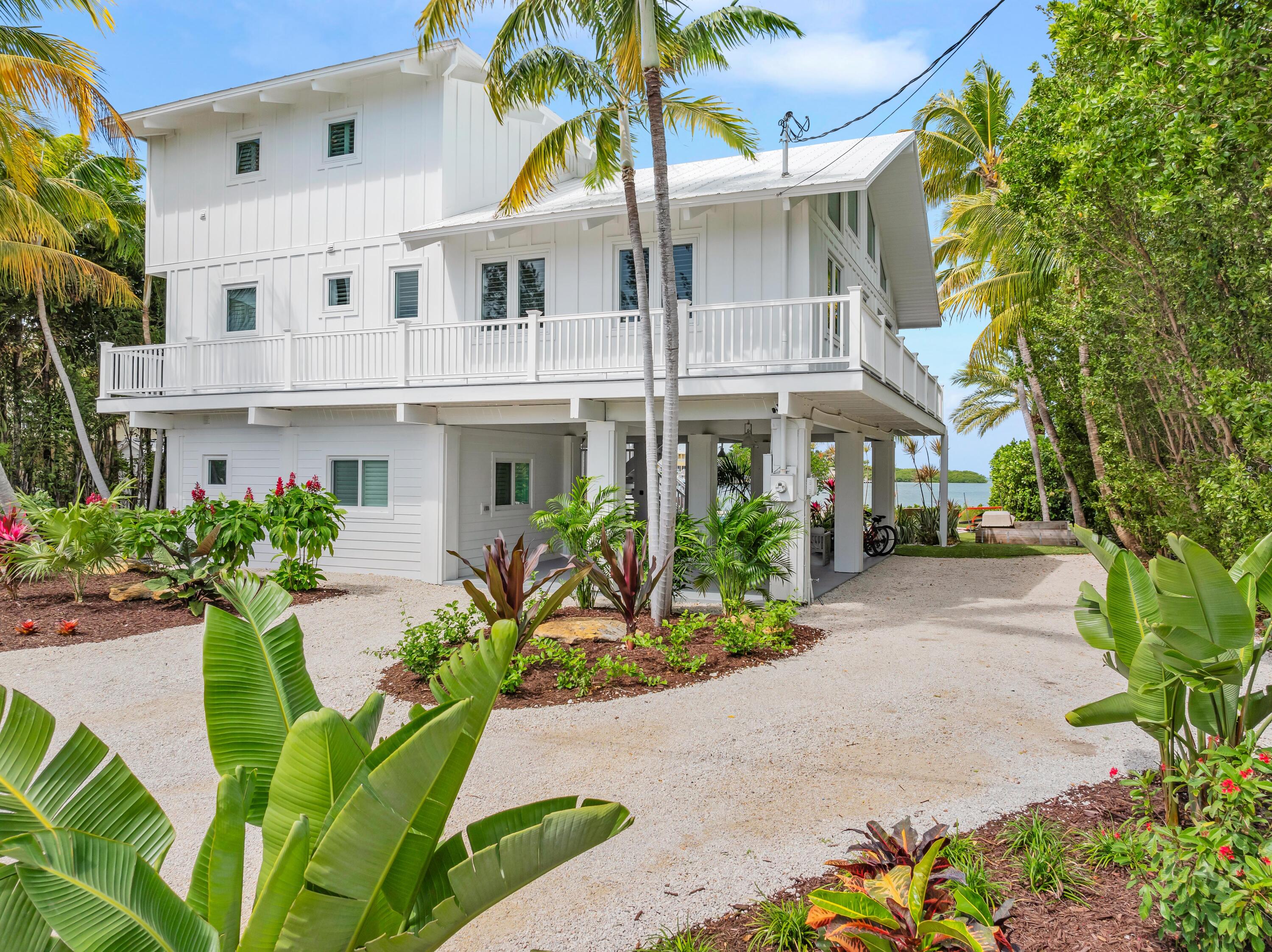 116 Gulf Side Drive Islamorada, FL 33036 - Photo 3 of 67 a view of a multi story residential apartment building