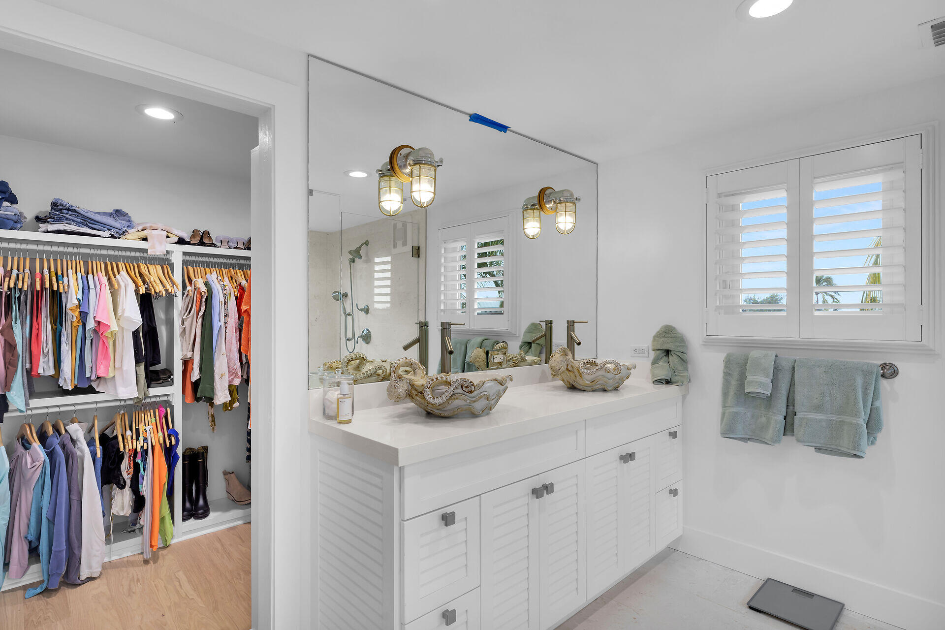 116 Gulf Side Drive Islamorada, FL 33036 - Photo 48 of 67 a bathroom with a double vanity sink and a mirror