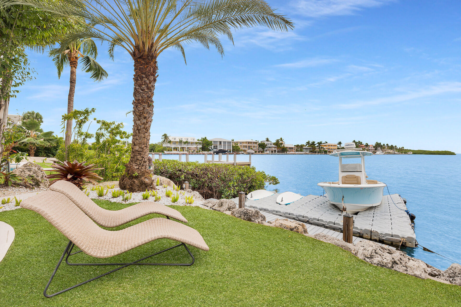 116 Gulf Side Drive Islamorada, FL 33036 - Photo 53 of 67 a backyard of a house with table and chairs