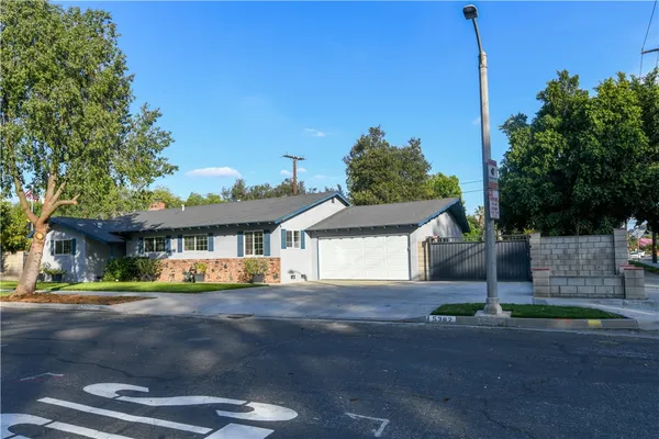 a front view of a house with a street
