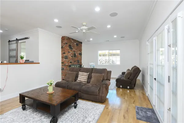 a living room with furniture rug and window
