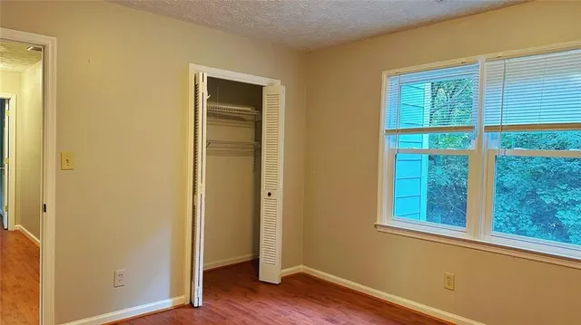 a view of front door with wooden floor
