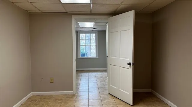 a view of an empty room with a window