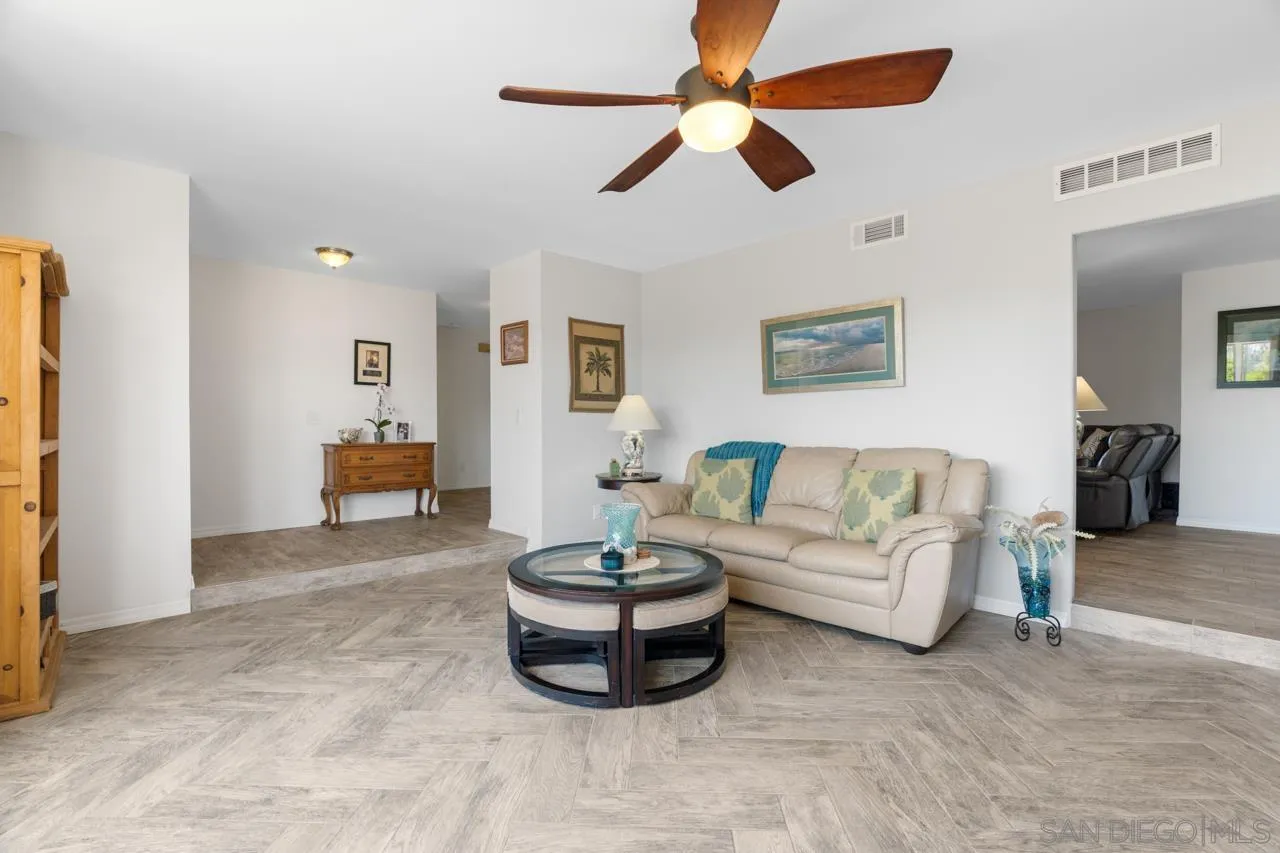 31478 Valley Center Road Valley Center, CA 92082 - Photo 13 of 66 a living room with furniture and a chandelier