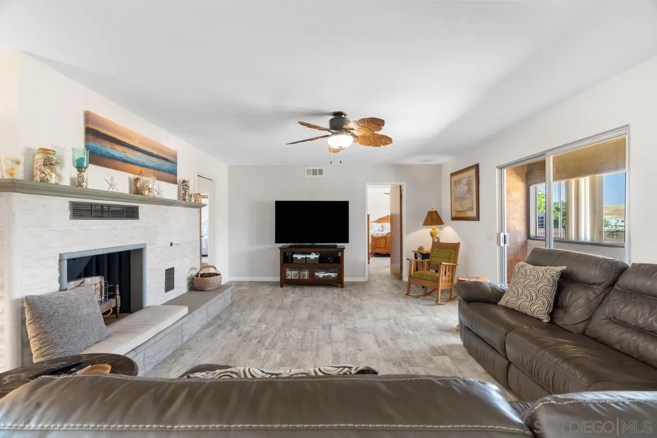31478 Valley Center Road Valley Center, CA 92082 - Photo 18 of 66 a living room with furniture and a fireplace