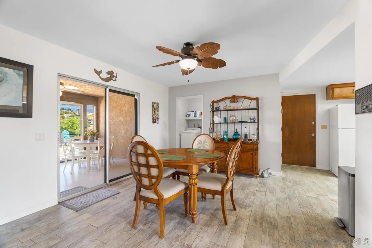 31478 Valley Center Road Valley Center, CA 92082 - Photo 22 of 66 a view of a dining room with furniture window and wooden floor