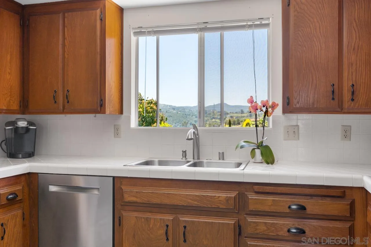 31478 Valley Center Road Valley Center, CA 92082 - Photo 29 of 66 a kitchen with a sink cabinets and window