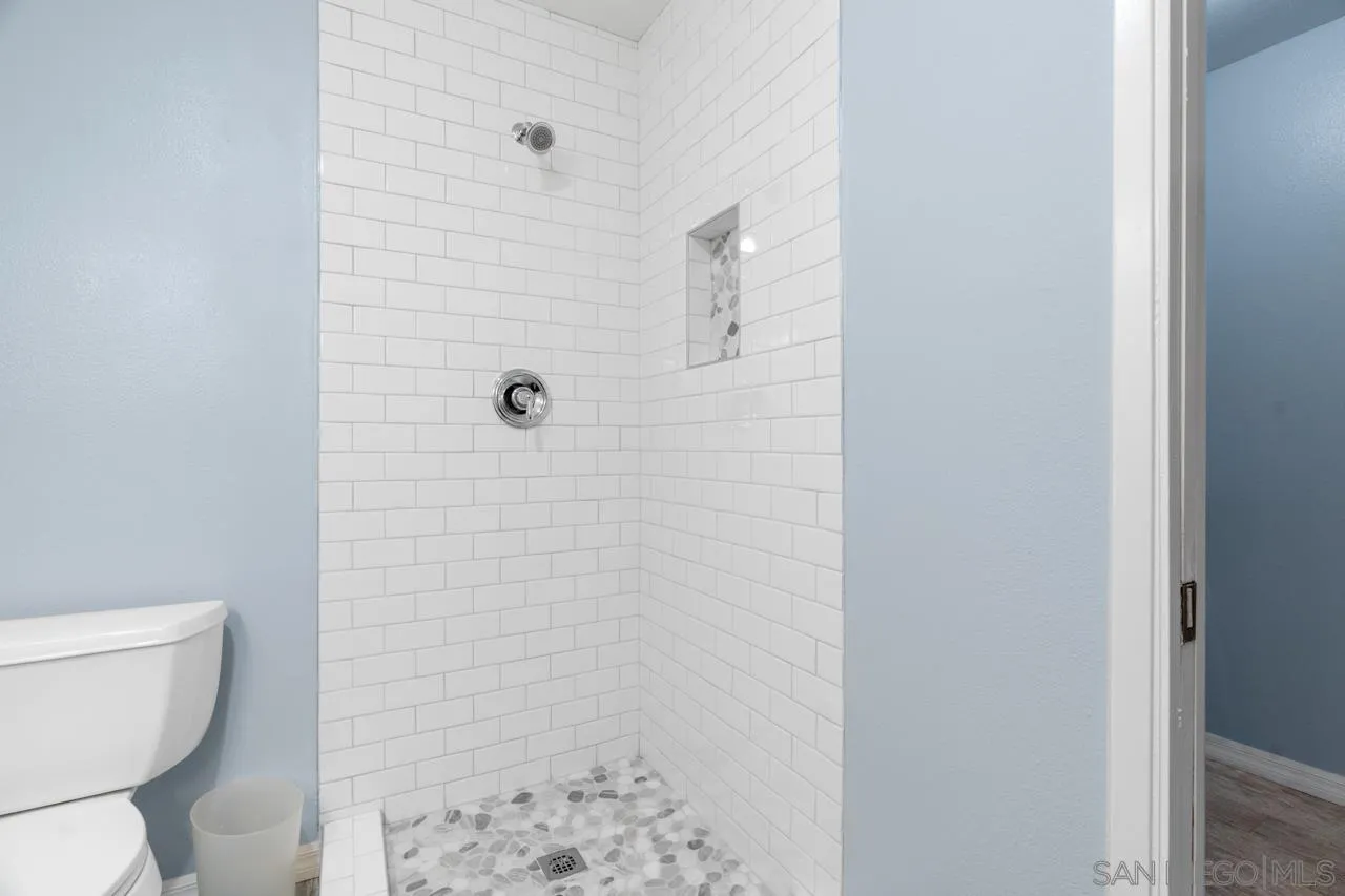 31478 Valley Center Road Valley Center, CA 92082 - Photo 33 of 66 a bathroom with a toilet and a shower