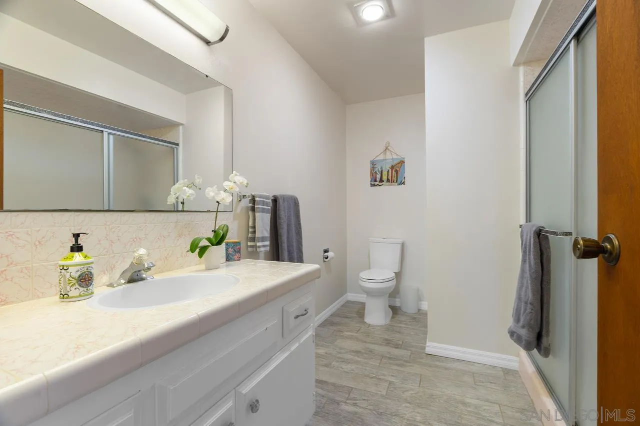 31478 Valley Center Road Valley Center, CA 92082 - Photo 36 of 66 a bathroom with a sink and a mirror