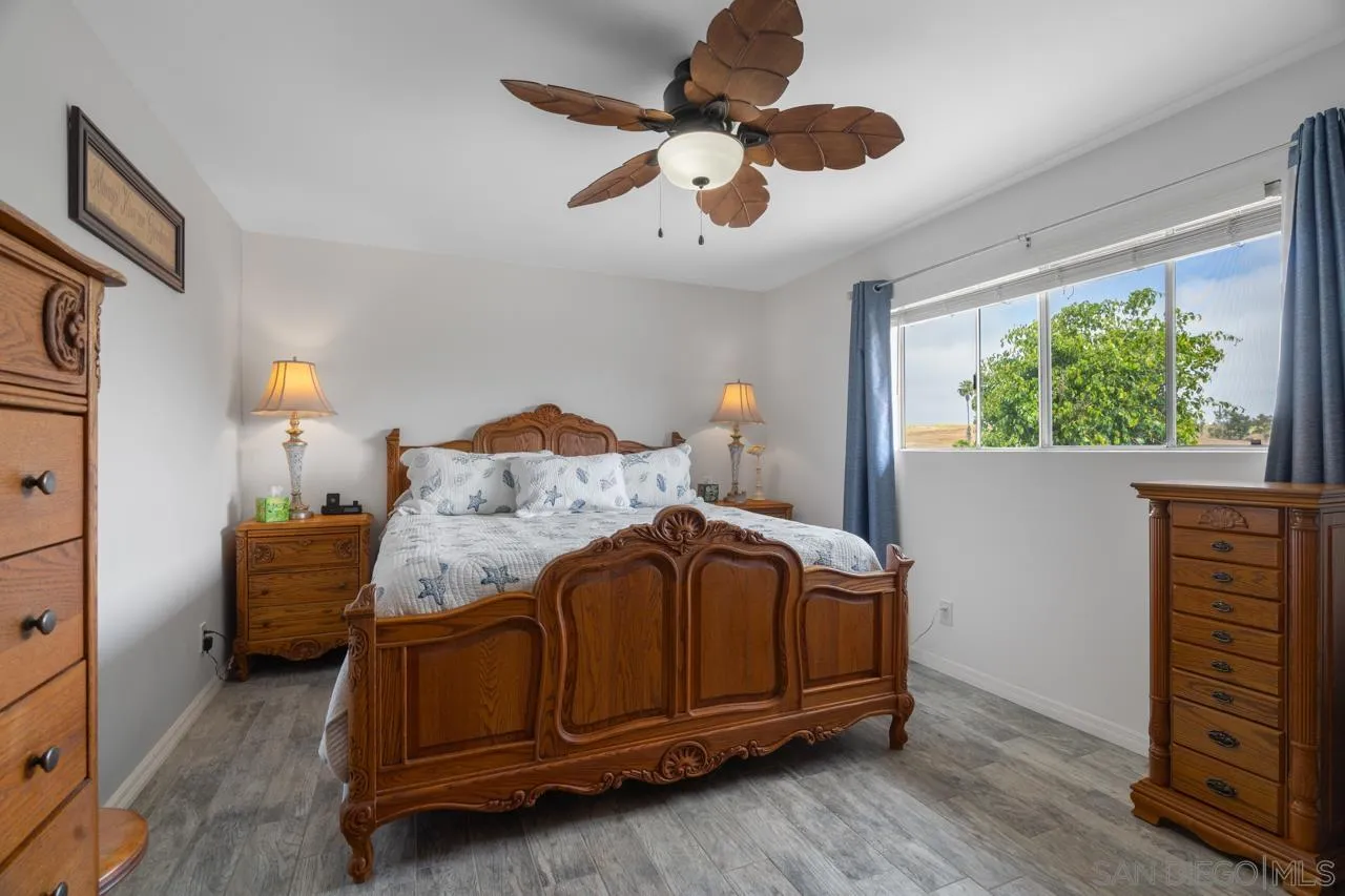 31478 Valley Center Road Valley Center, CA 92082 - Photo 39 of 66 a bedroom with a bed and a large window