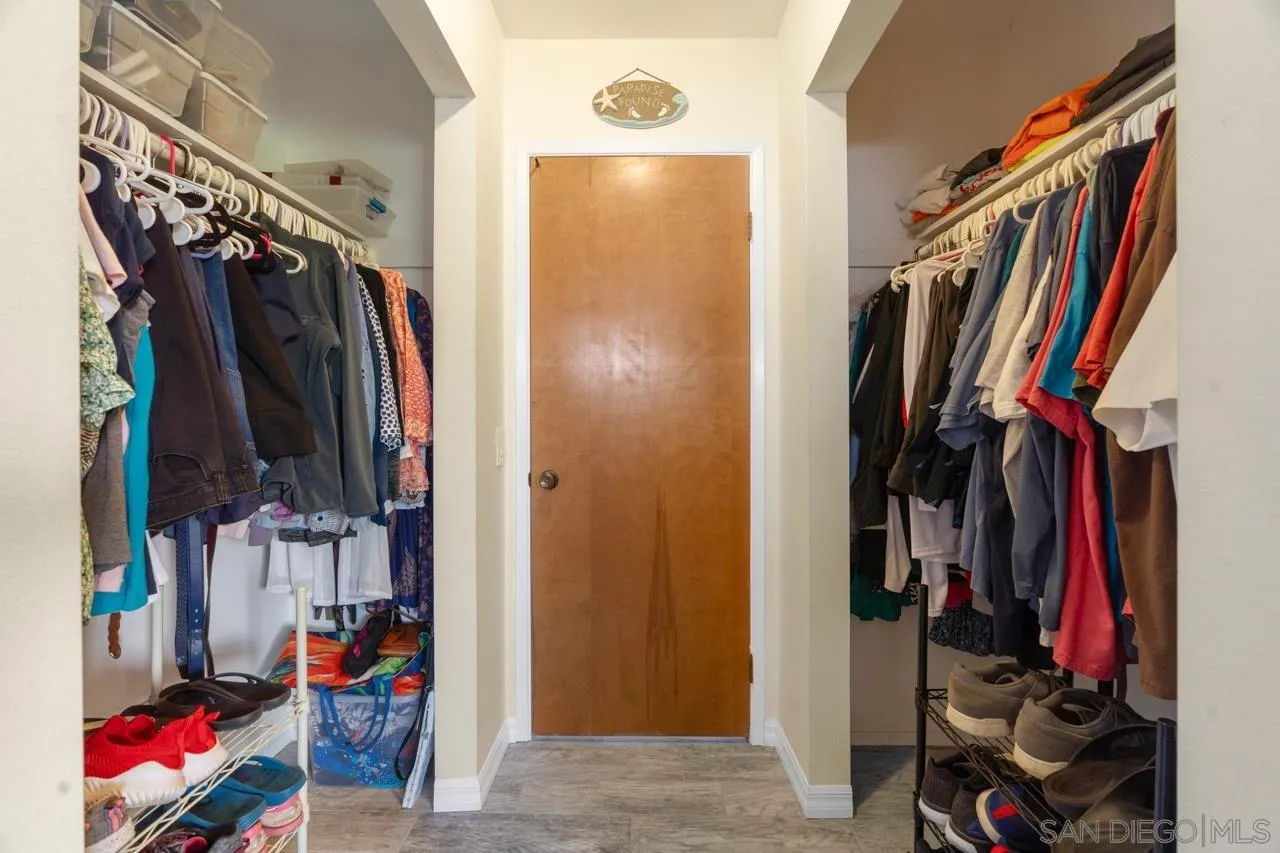 31478 Valley Center Road Valley Center, CA 92082 - Photo 41 of 66 a view of walk in closet with clothes and shoes