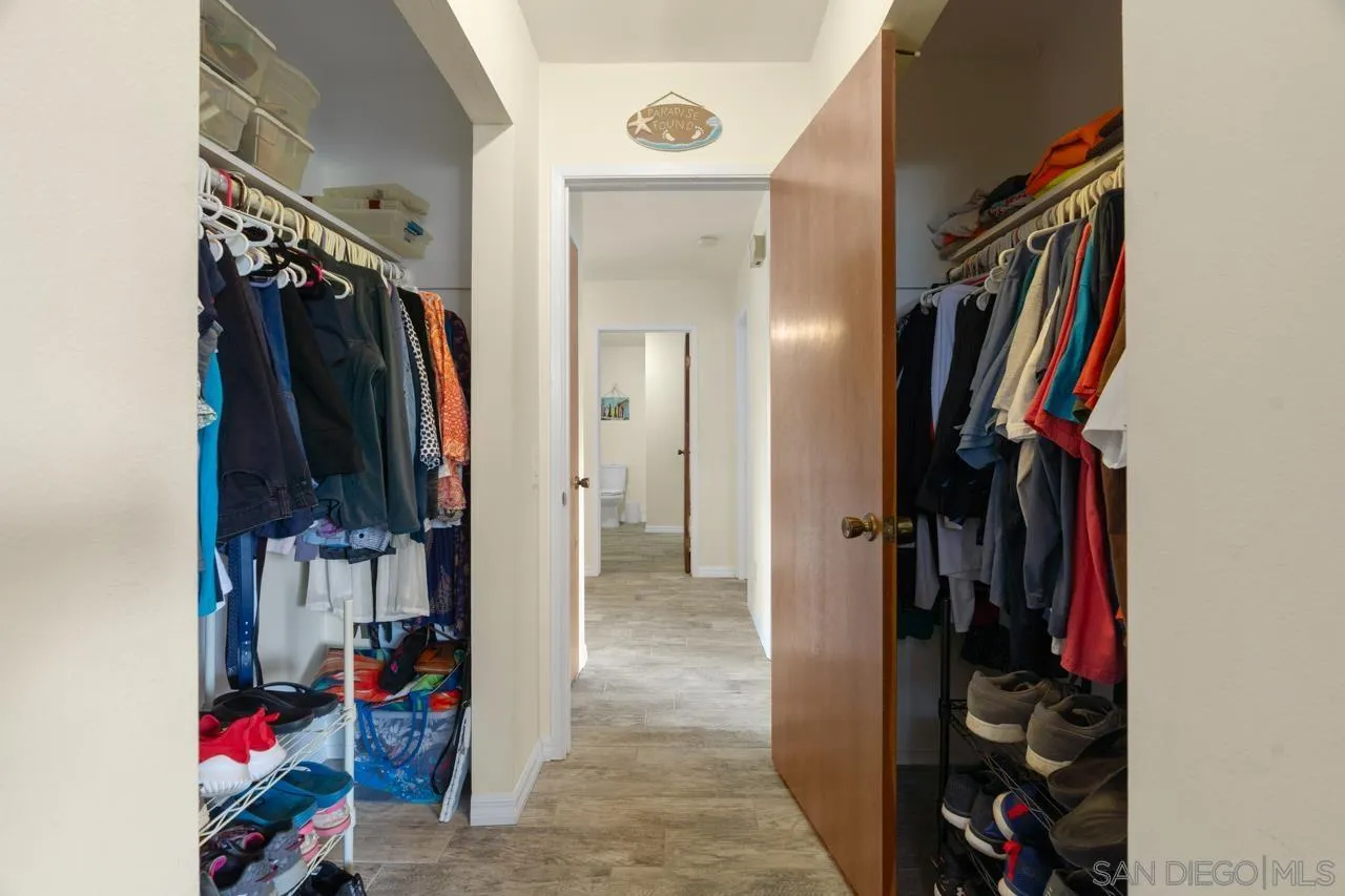 31478 Valley Center Road Valley Center, CA 92082 - Photo 42 of 66 a view of walk in closet with clothes and shoes