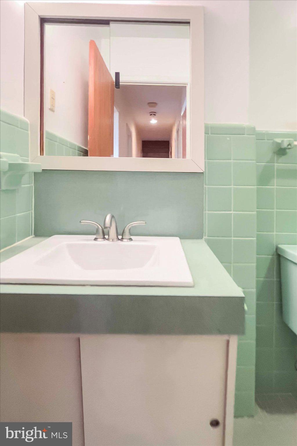 675 Trephanny Lane Wayne, PA 19087 - Photo 16 of 36 a bathroom with a sink and a mirror