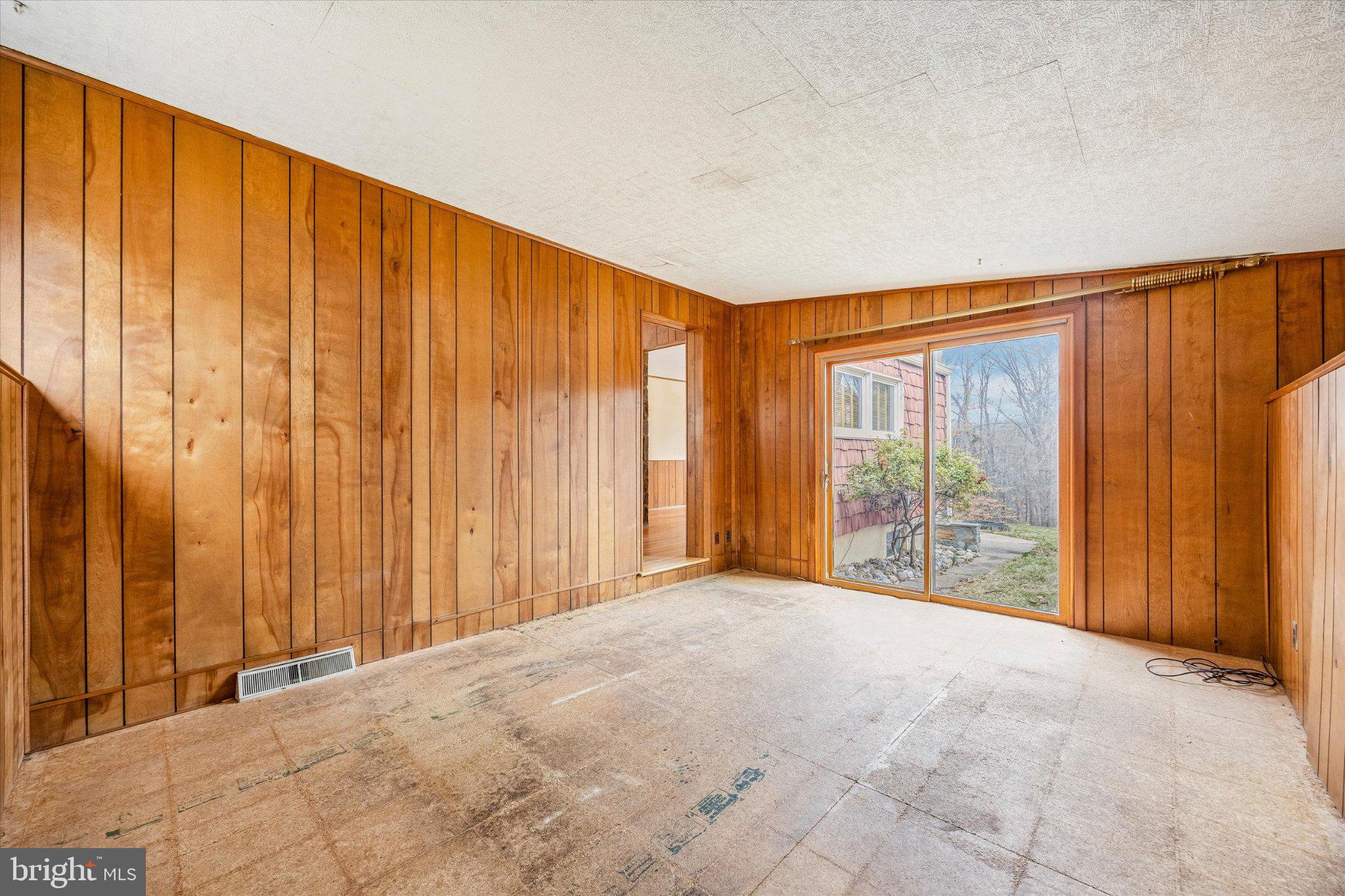 675 Trephanny Lane Wayne, PA 19087 - Photo 9 of 36 a view of an empty room with wooden walls