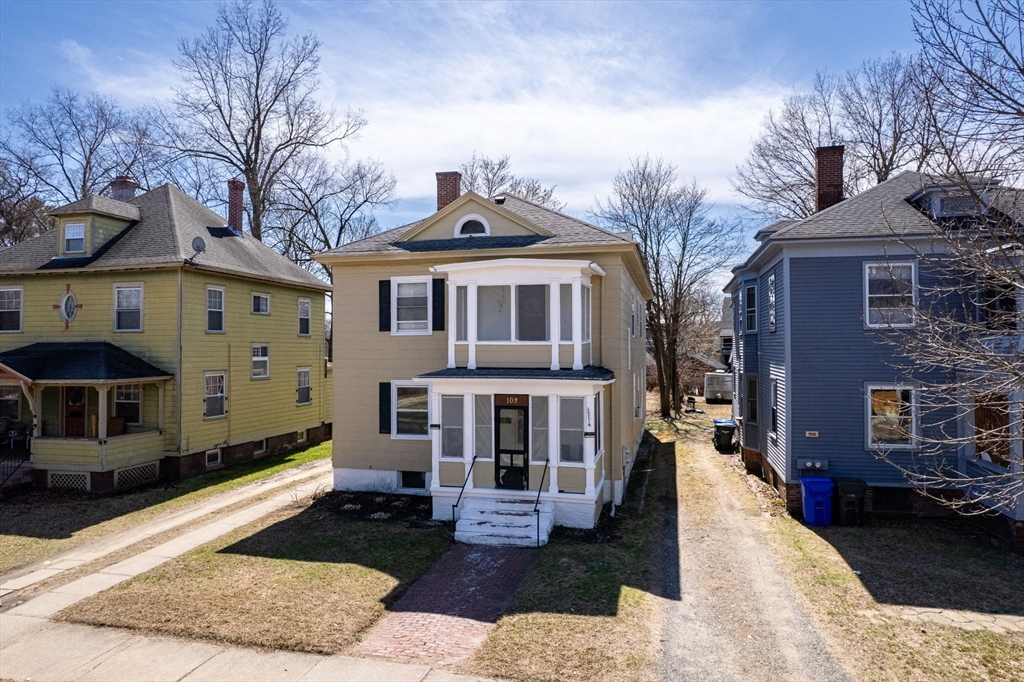 a front view of a house with a yard