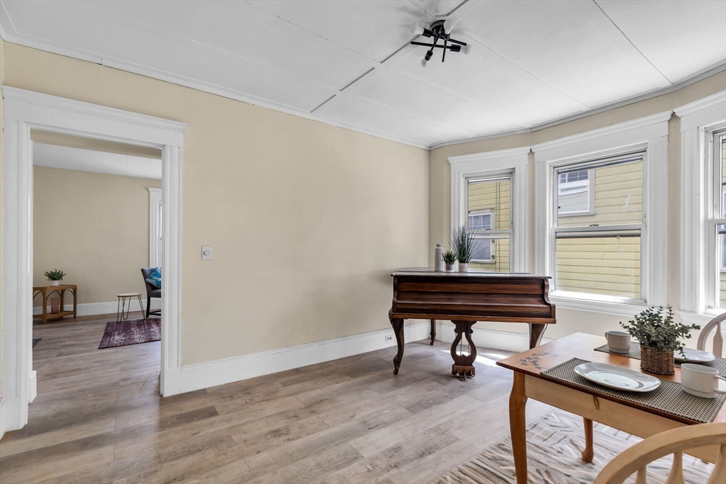 102 Florida Street Springfield, MA 01109 - Photo 12 of 45 a room with furniture and wooden floor