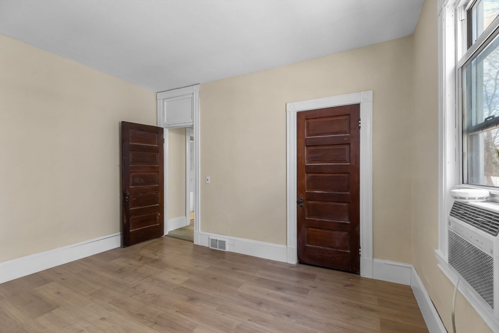 102 Florida Street Springfield, MA 01109 - Photo 17 of 45 wooden floor and closet in a room