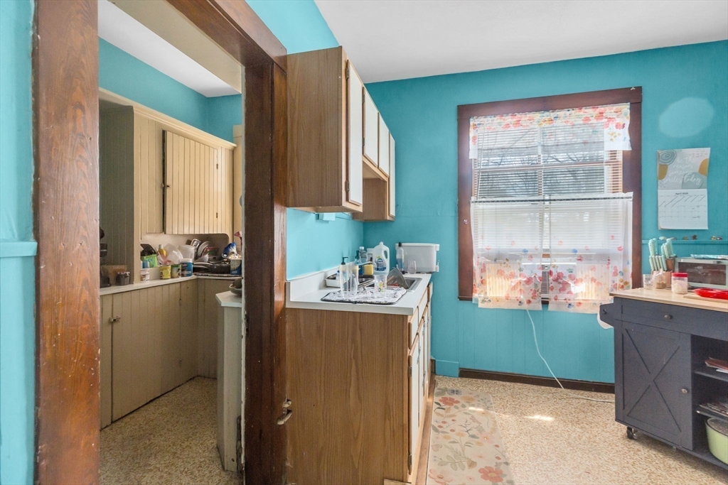 102 Florida Street Springfield, MA 01109 - Photo 23 of 45 a kitchen with stainless steel appliances granite countertop a refrigerator and a stove