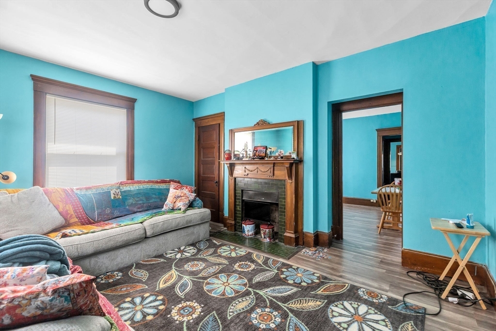 102 Florida Street Springfield, MA 01109 - Photo 25 of 45 a living room with furniture and a fireplace