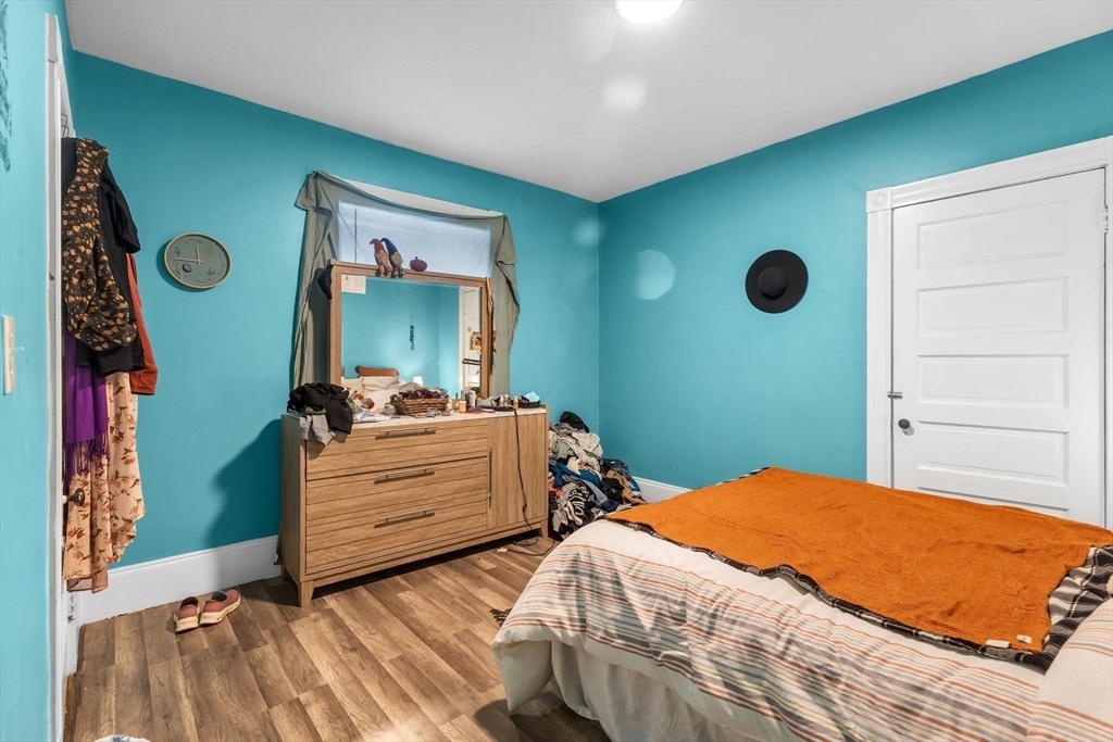 102 Florida Street Springfield, MA 01109 - Photo 26 of 45 a bedroom with a bed and a dresser