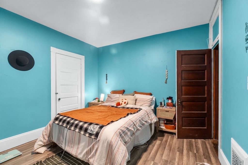 102 Florida Street Springfield, MA 01109 - Photo 27 of 45 a bedroom with a bed and a cabinets