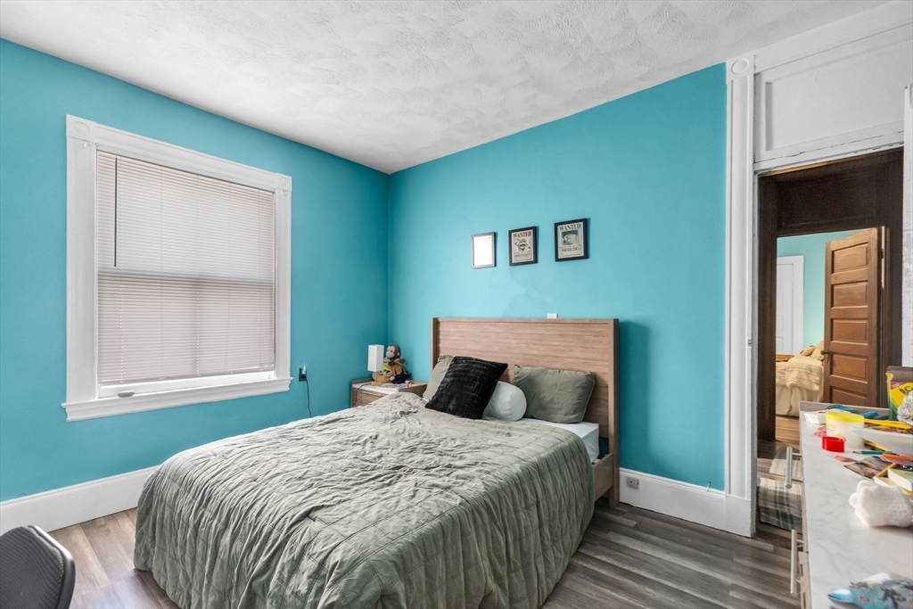 102 Florida Street Springfield, MA 01109 - Photo 28 of 45 a bedroom with a bed and a window