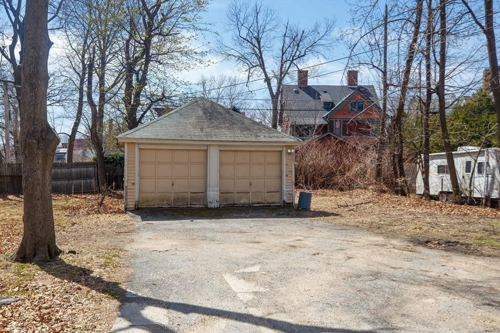 102 Florida Street Springfield, MA 01109 - Photo 38 of 45 a view of a house with a yard covered with snow in front of house