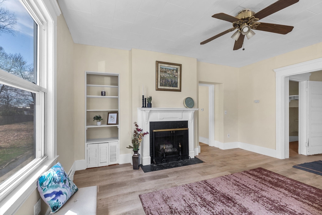 102 Florida Street Springfield, MA 01109 - Photo 8 of 45 a living room with furniture and a fireplace
