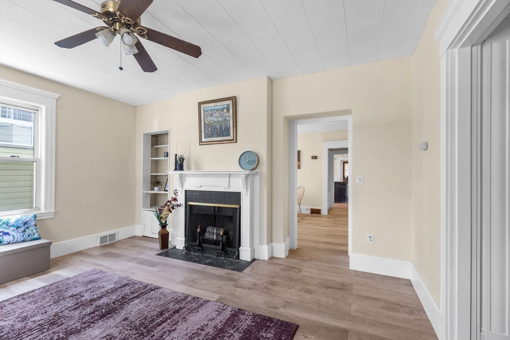 102 Florida Street Springfield, MA 01109 - Photo 9 of 45 a living room with furniture and a fireplace