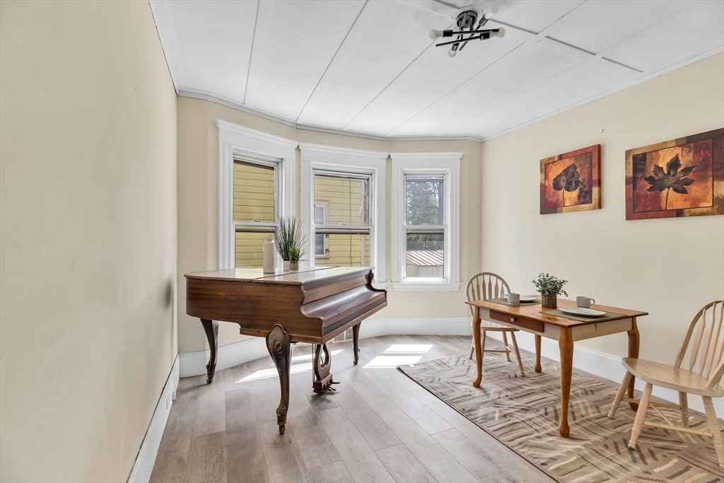 102 Florida Street Springfield, MA 01109 - Photo 10 of 45 a living room with furniture and a wooden floor