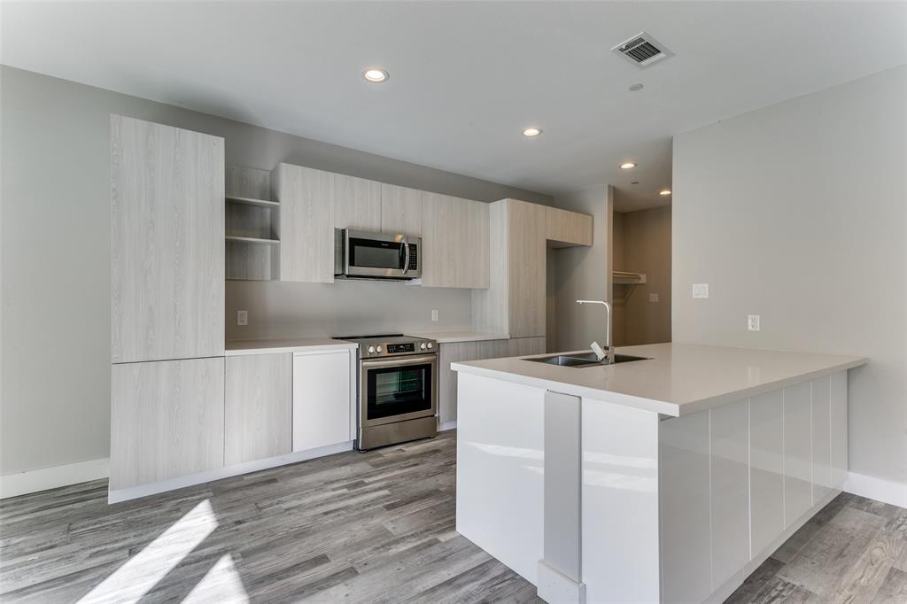 3021 Mayeda Circle Wylie, TX 75098 - Photo 4 of 13 a kitchen with cabinets and a stove